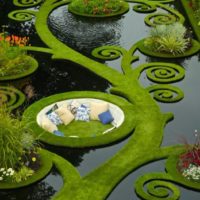 Decorative design of an artificial pond in the garden