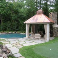Outdoor pool with a gazebo on the countryside