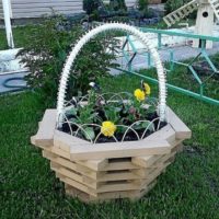 Wooden flowerbed in the form of a basket