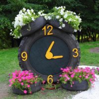 Flowerbed clock from old tires