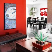 Red wall and mosaic panels in the living room
