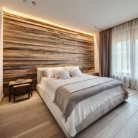Wall decoration over the head of the bed made of natural wood