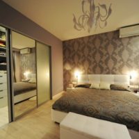 Cabinets with mirrored doors in the bedroom interior