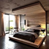 Legno e cemento in un interno camera da letto di una casa di campagna