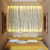 Decorating a niche over a bed with bamboo sticks