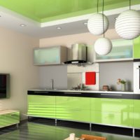 Glossy facades of olive-colored kitchen cabinets