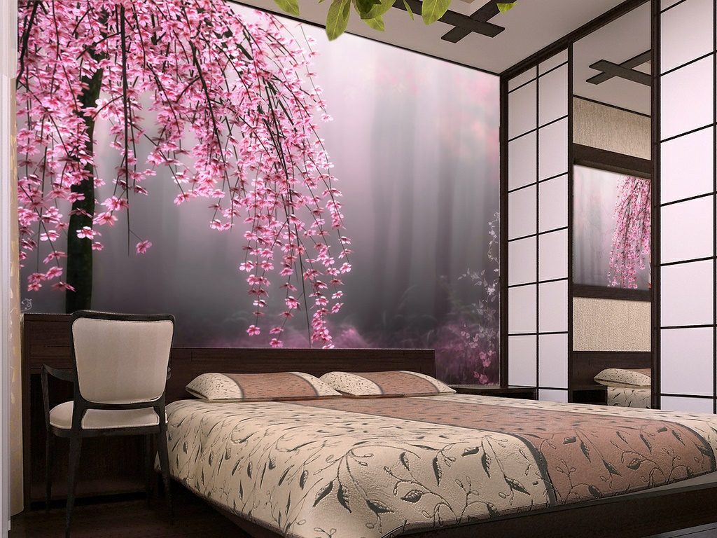 Bright photo wallpaper with flowering branches in the design of the bedroom