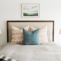 Three variegated pillows on the bed in the bedroom