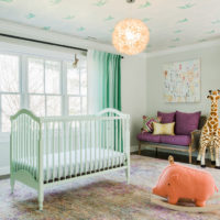Mint color curtains in the room for the baby
