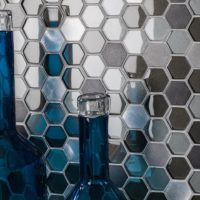 Mosaic bee honeycombs and glass bottles