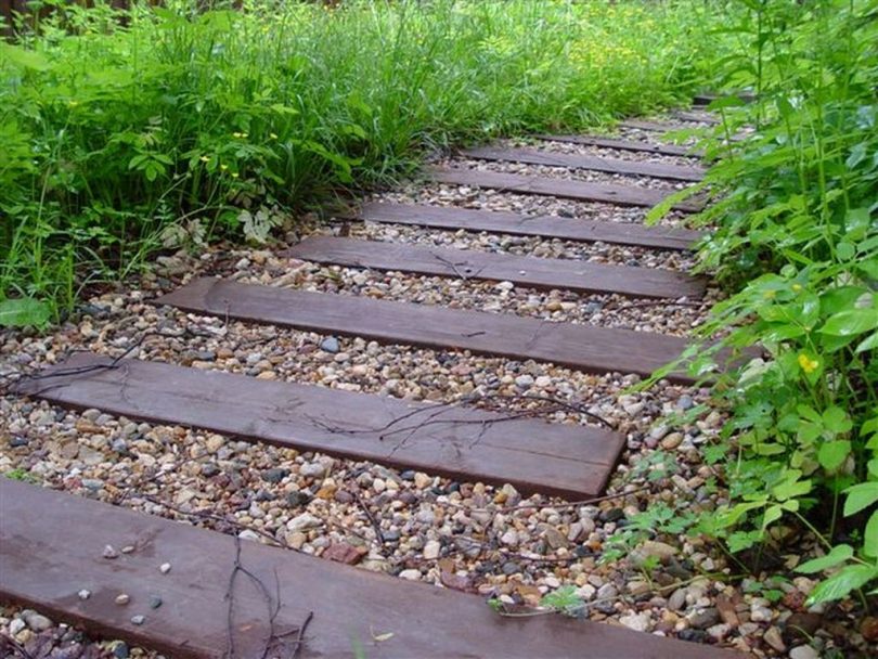 A garden path from bars with crushed stone backfill