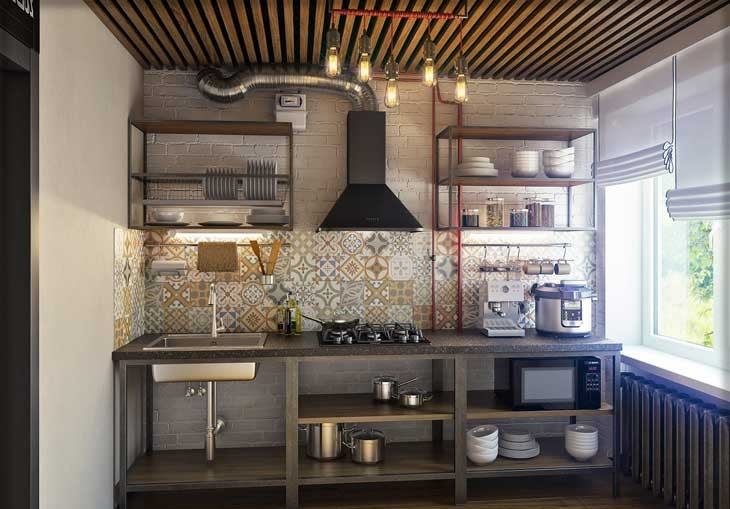 The interior of the kitchen of a studio apartment in the loft style