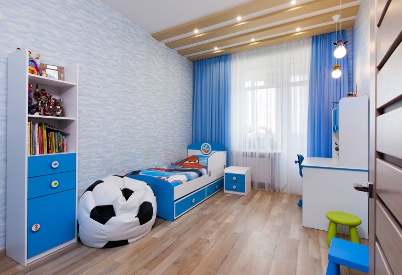 Blue kids room with laminate flooring