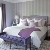 Lilac towel on the bed in the bedroom