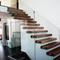 Glass railing staircase to the second floor