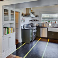 Dark linoleum with a light stripe in the kitchen of a private house