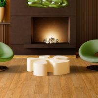 Modern armchairs in front of the fireplace in the living room