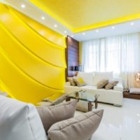 Living room decor in bright yellow colors.