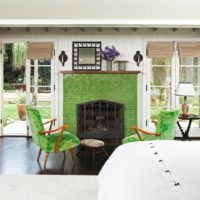 Green fireplace in the living room of a country house