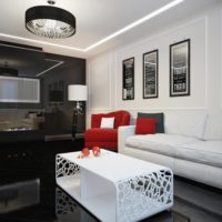 Red as an accent in a black and white bedroom
