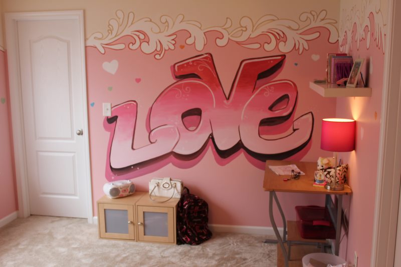 The inscription in pink colors on the wall of the girl's room