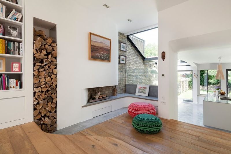 Storage of firewood for the fireplace in the recess in the wall