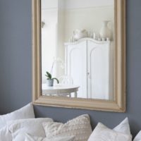 Provence style mirror on the living room wall