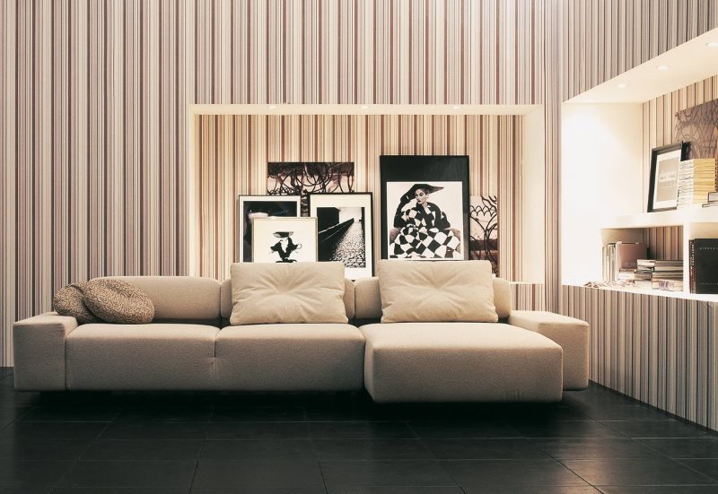 Interior of a living room with narrow stripes on paper wallpaper