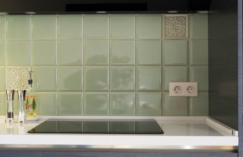 Olive-colored ceramic tiles in kitchen design