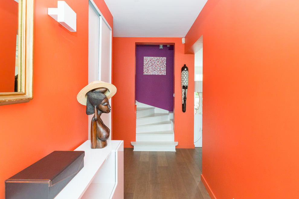The interior of the hallway of an urban apartment in orange
