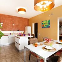 orange color in the interior of the kitchen-living room