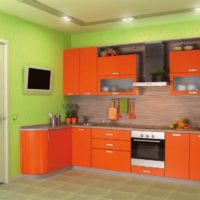 Green walls and orange kitchen set