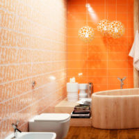 Orange ceramic tile in the bathroom of a city apartment