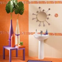 Wall and floor decoration in the bathroom with orange tiles