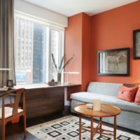 Gray and orange colors in the interior of a bedroom