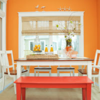 Bright eating area with a bright orange wall