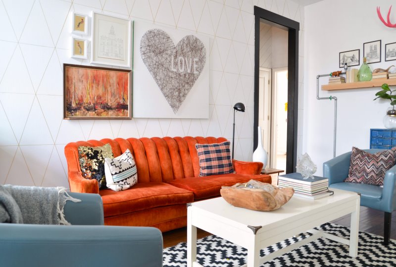 Orange sofa in the living room with white walls