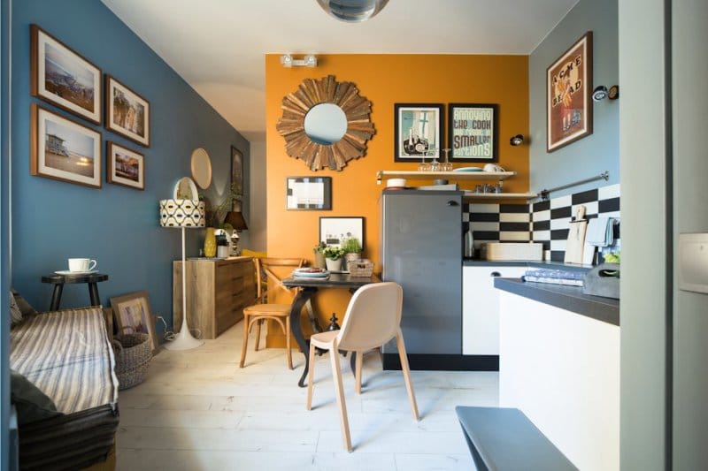 Retro style kitchen design using orange in painting the walls.