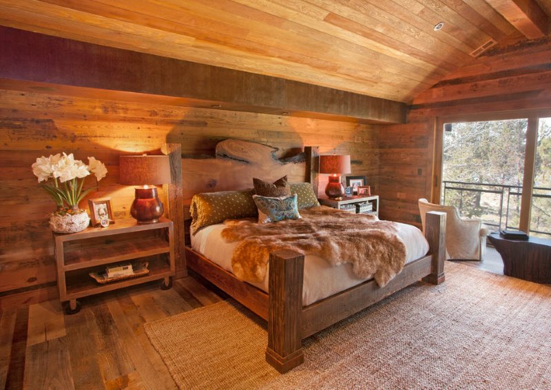 Interior of a bedroom in a country house with natural wood trim