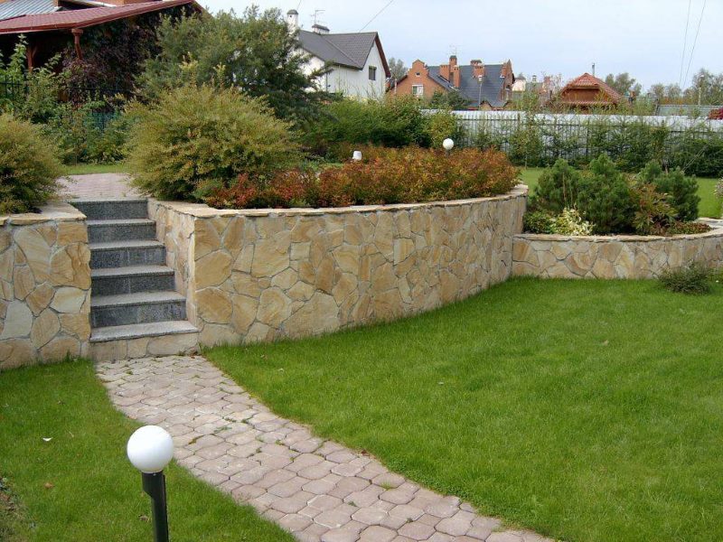 Concrete and stone retaining wall in landscaping
