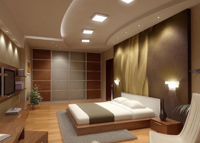 Combined ceiling with recessed lights in the bedroom interior