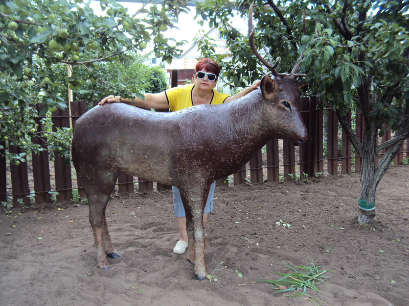 Sculpture of the Far East deer made of polyurethane foam in the decor of a summer cottage