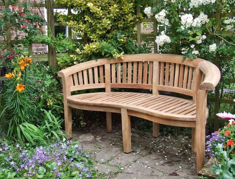Wooden bench deep in the garden