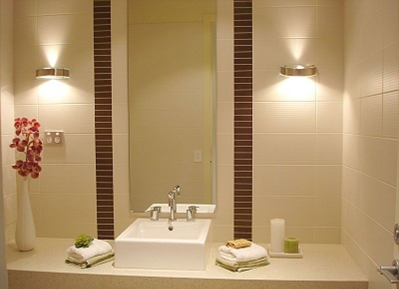 Wall lights by the bathroom mirror