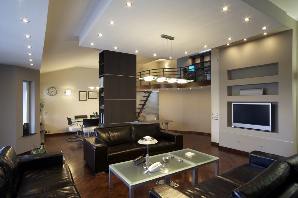 Spot recessed fixtures in the design of the living room apartment