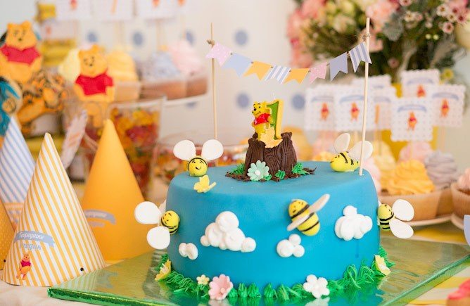 Children's cake in the style of Winnie the Pooh for a child's birthday