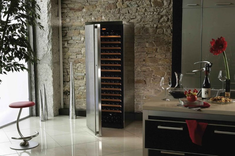 Wine cabinet with open door in the interior of the kitchen