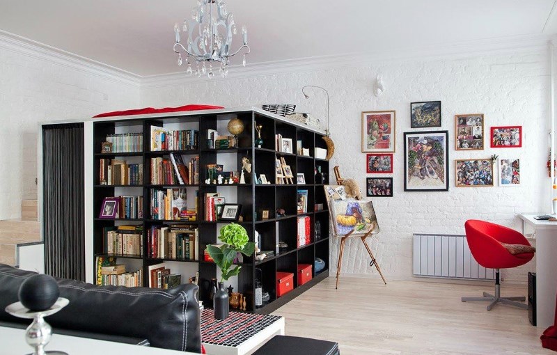 Zoning of a studio apartment with book racks