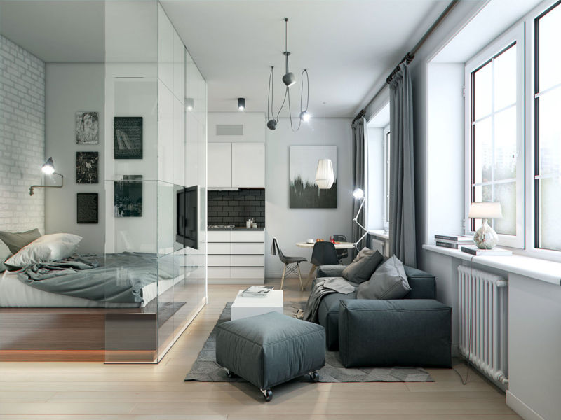 One-room apartment with a bed behind a glass partition
