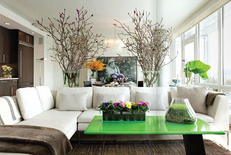 Design of a bright living room with a white corner sofa